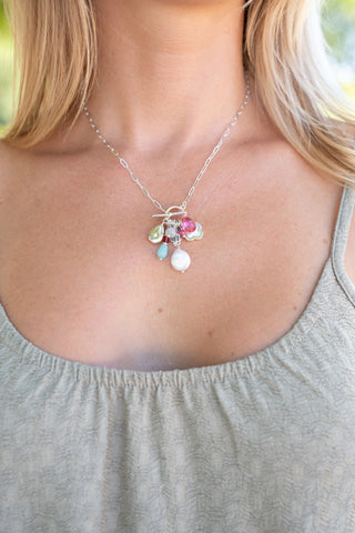 Necklace with colorful beads worn by a person